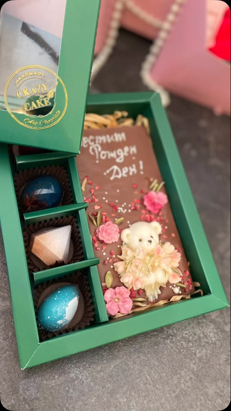 Gift box with chocolate bar and bonbons